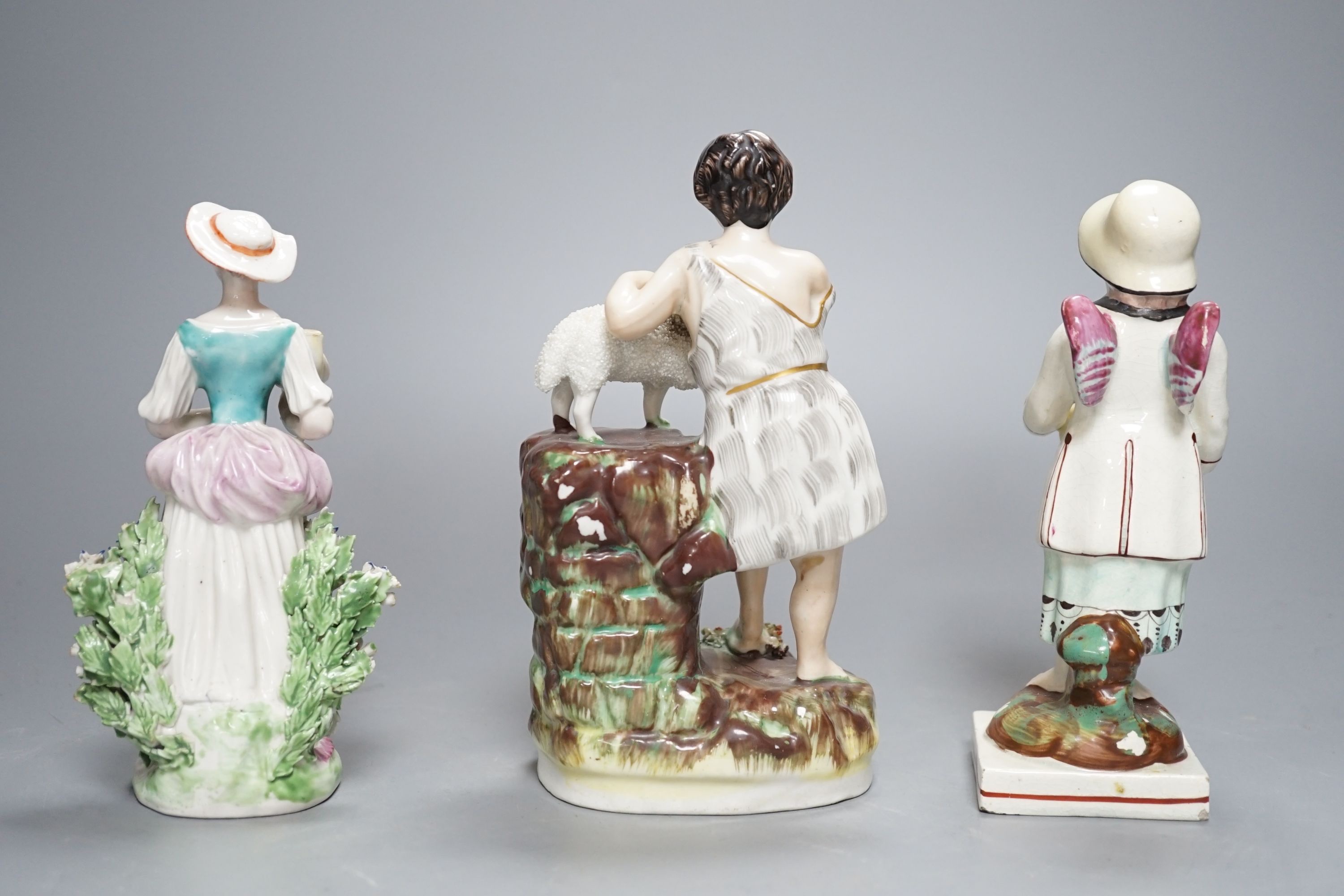 A Chelsea-Derby bocage figure, 16cm, 19th century pearlware figure of Cupid disguised and one other Staffordshire figure